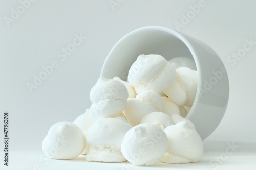 Delicious and crunchy meringue dessert on a white background.