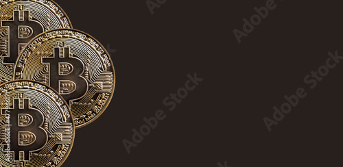 Bitcoins cryptocurrency coins on background with copy space for text. BTC crypto banner. © valiantsin