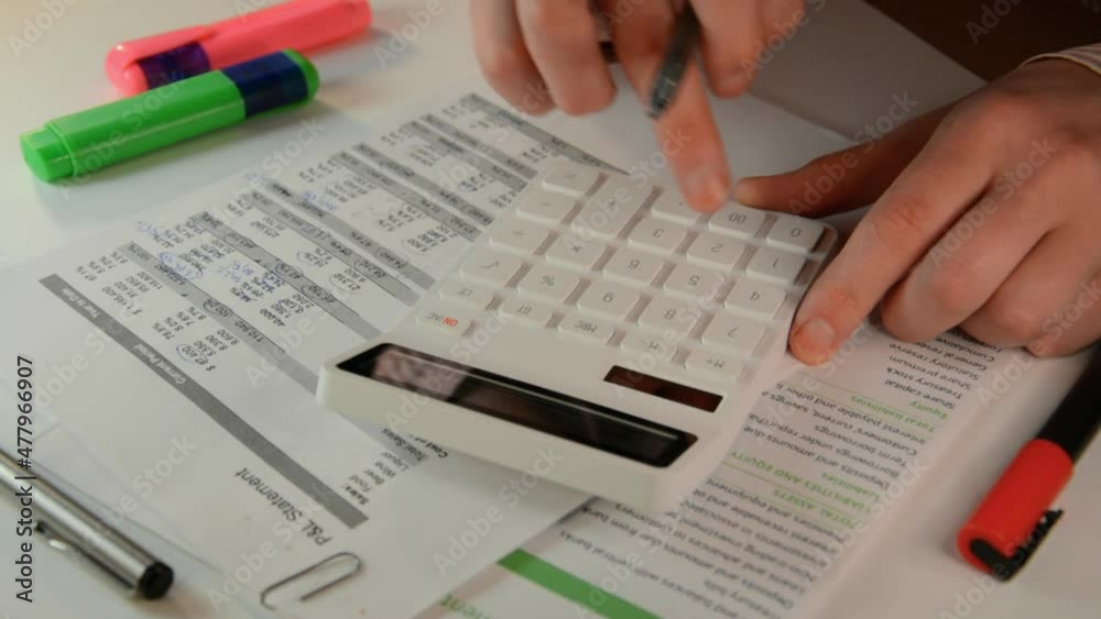 Business calculator and financial statements close up Business calculator and financial statements close up