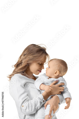 Vertical photo of a happy mother with a baby. They look at each other. Isolated on white.