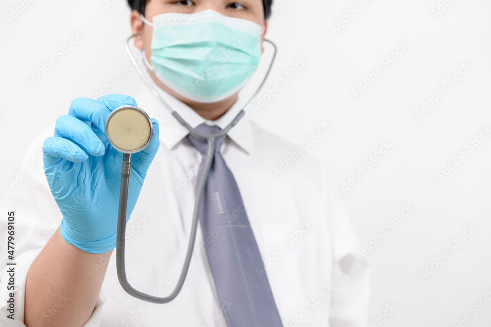 Young doctor holding stethoscope on white background. Young doctor holding stethoscope on white background.