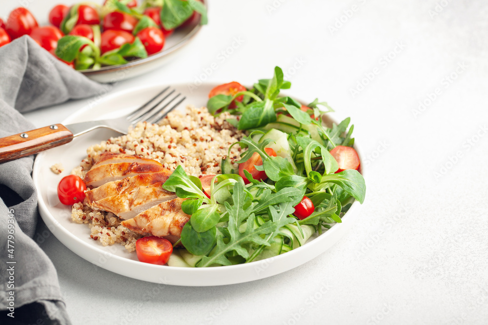Turkey fillet or chicken, quinoa and vegetable salad in plate. Diet concept food. Turkey fillet or chicken, quinoa and vegetable salad in plate. Diet concept food.