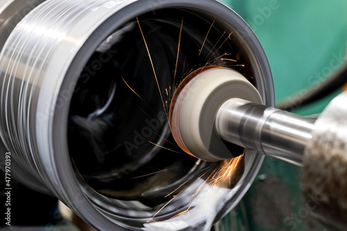 Coolant is spilled during internal grinding of a part on the CNC machine.