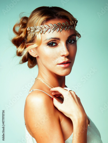 Obraz na plátně young blond woman dressed like ancient greek godess, gold jewelry close up isola