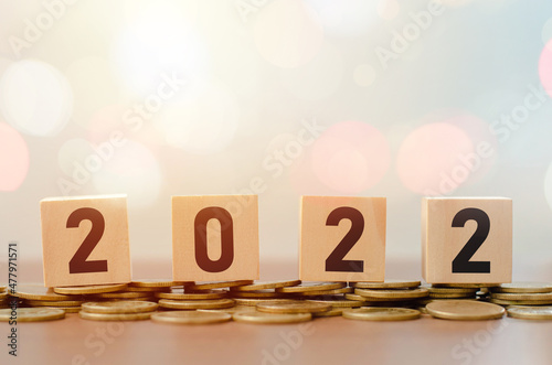 wooden block with number 2022 in new beginning happy new year with bokeh background