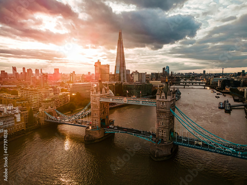 Aerial view to the Beautiful Tower Bridge and skyline of London  UK  during the sunset.
