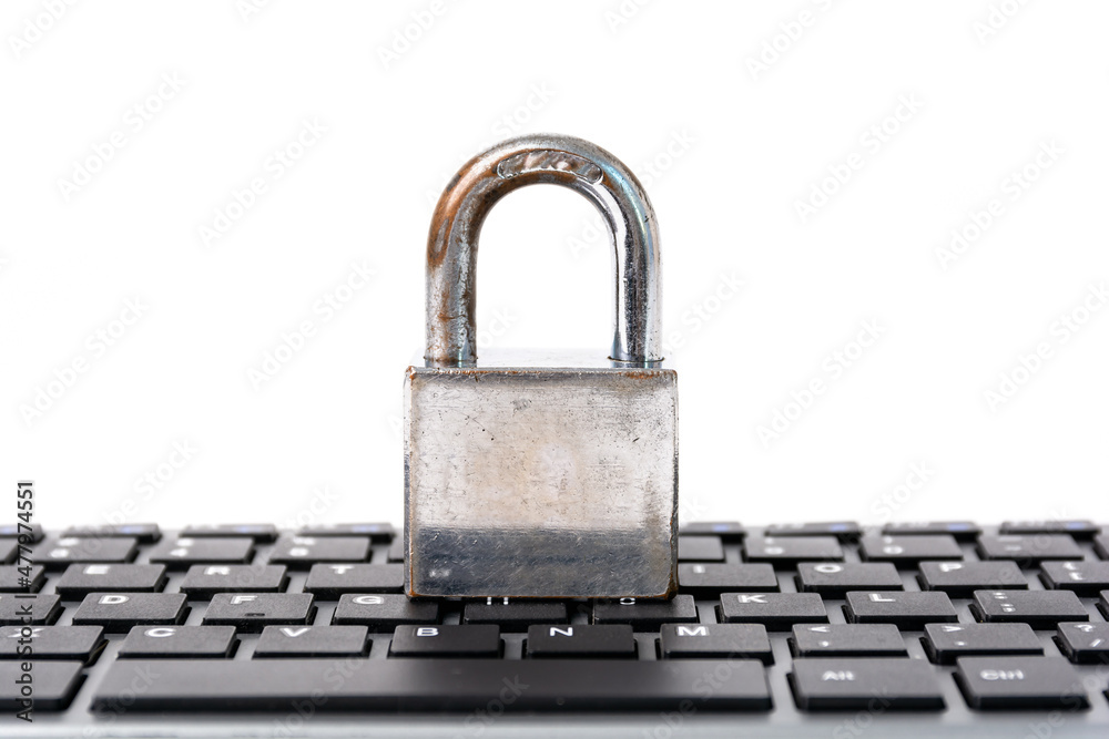 Padlock on keyboard in white background for computer internet security concept. Padlock on keyboard in white background for computer internet security concept.