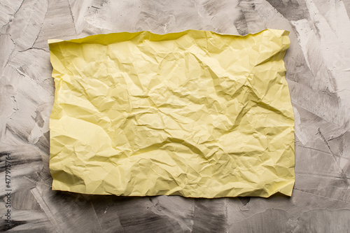 crumpled paper on concrete