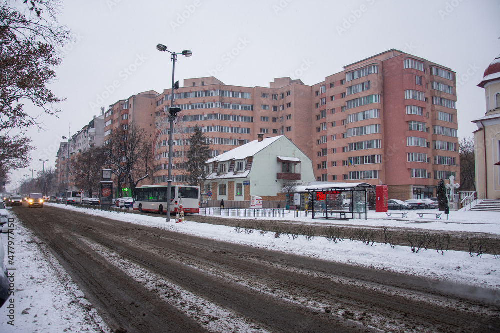 Independence Boulevard in December, in Bistrita, Romania, 2021 ,snowy boulevard 