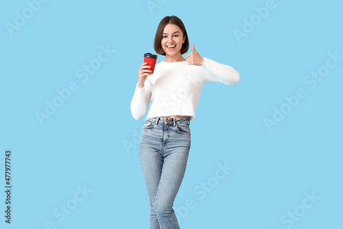 Beautiful woman with cup of...
