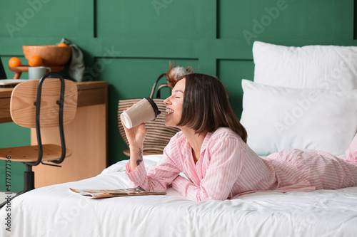 Beautiful woman with cup of...
