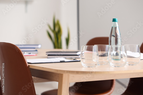 Empty glasses on table in conference room, closeup