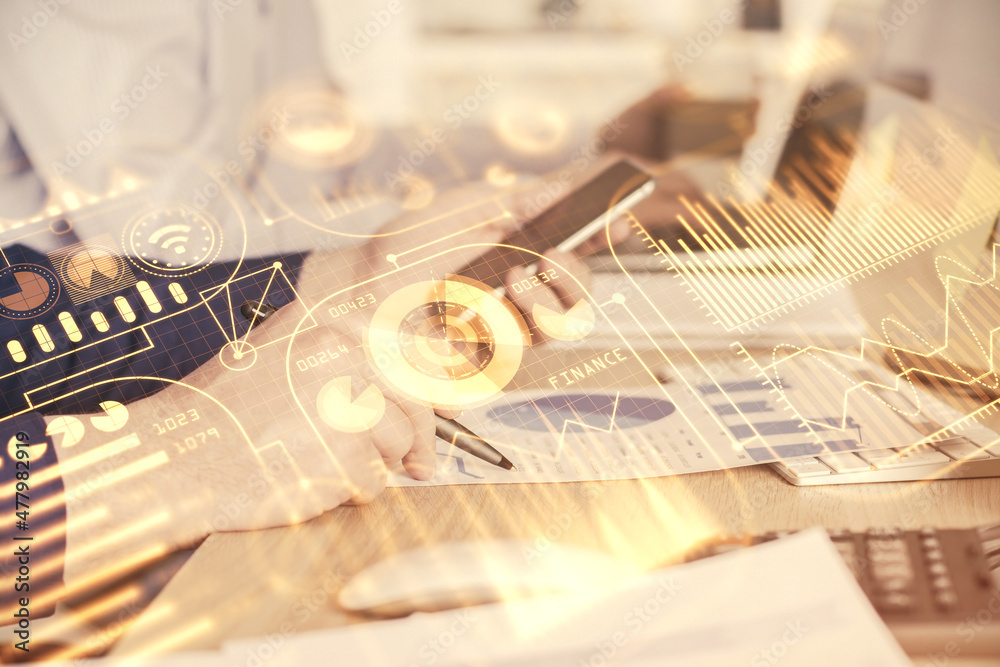 Double exposure of man's hands holding and using a digital device and tech theme hologram drawing. Technology concept. Double exposure of man's hands holding and using a digital device and tech theme hologram drawing. Technology concept.