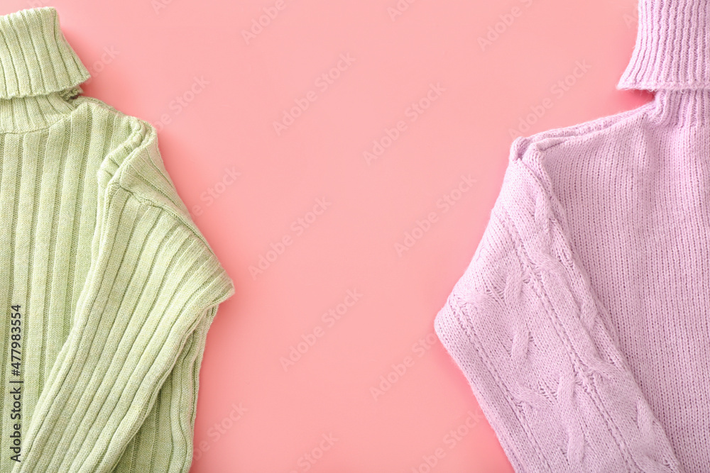 Knitted roll-neck sweaters on pink background Knitted roll-neck sweaters on pink background