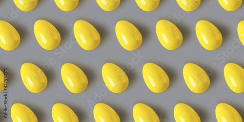 Seamless pattern with eggs for Easter wrapping paper, greeting cards, branding identity. Illuminating yellow colored chicken eggs on ultimate gray concrete background, top view flat lay. 