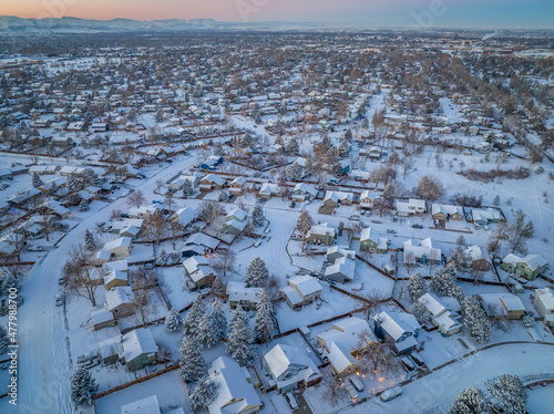 winter dusk over residential area of Fort Collins in northern Colorado after snowstorm, aerial view