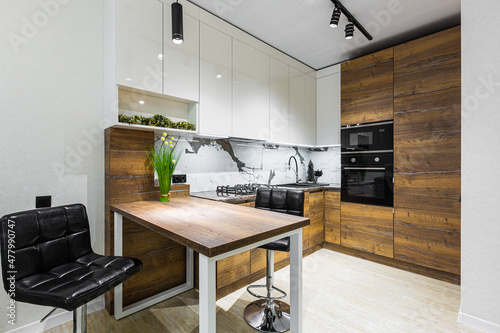 Modern wooden kitchen in a small apartment, apartment interior