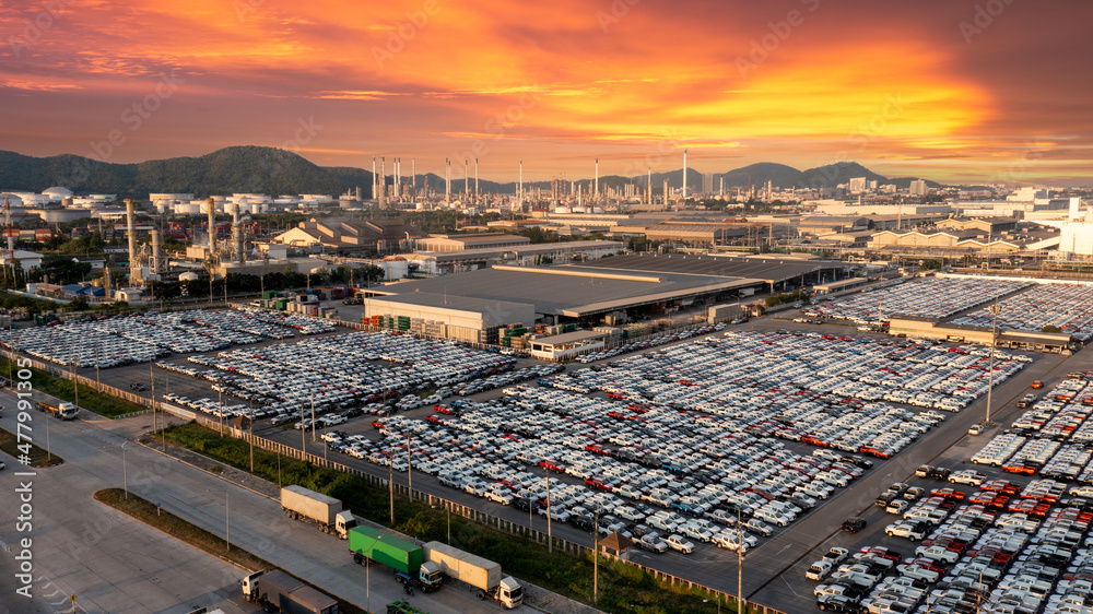Obraz premium Aerial view a lot of new car for import and export shipping by ship , Smart dealership at car depot , New car at car factory