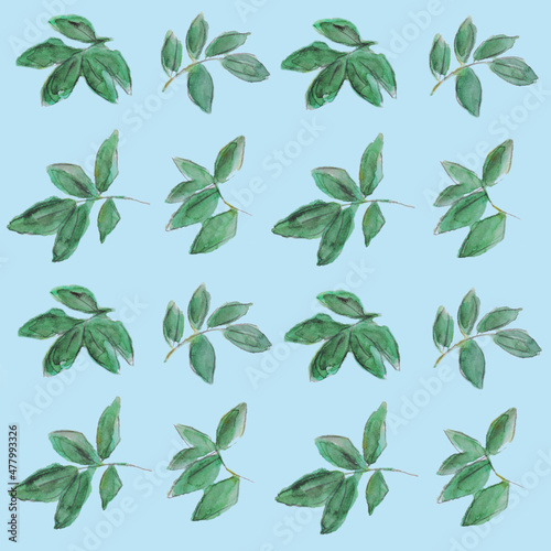Seamless background. Branches of trees with green leaves on a blue background. Watercolor illustration. Four repeating elements 
