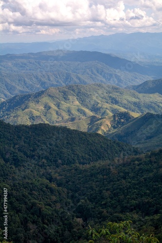Beautiful view of Landscape of Doi Sakad mountain valley in Pua, Nan Province, Thailand during winter season, small village nestled in a forested northern valley of pure air