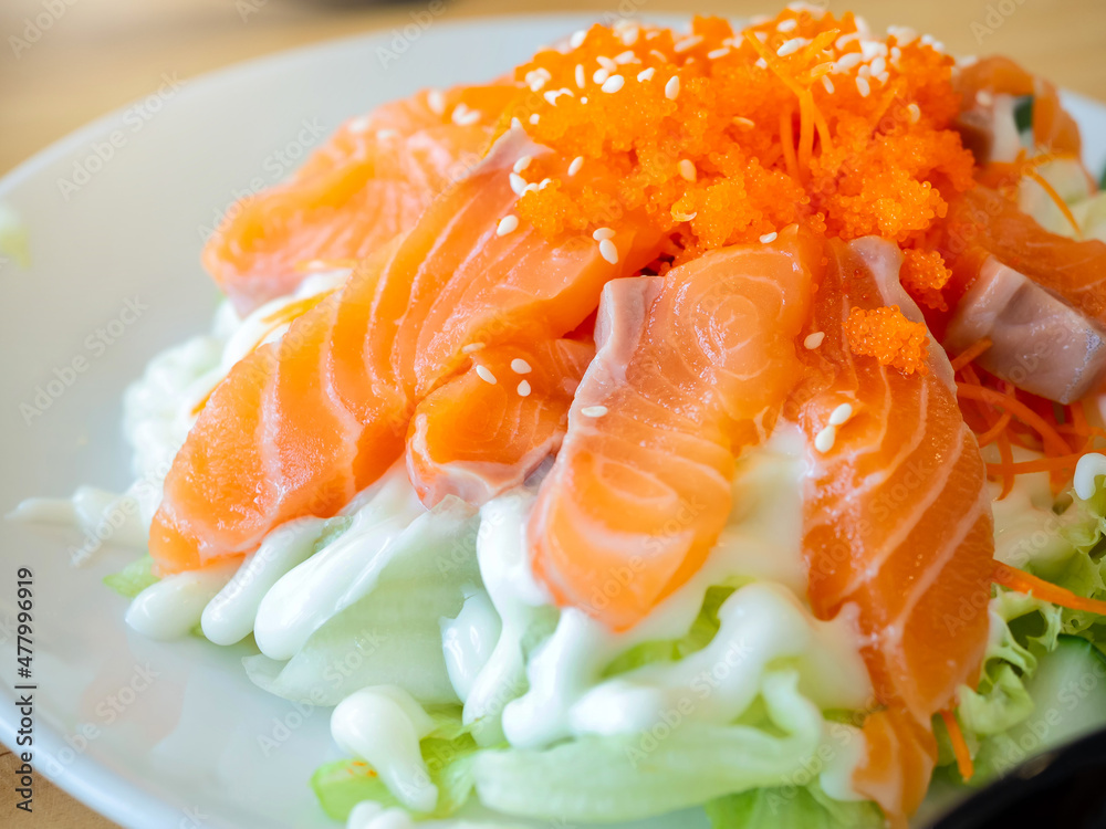 Japanese salad, raw salmon and mayonnaise topped with shrimp roe or