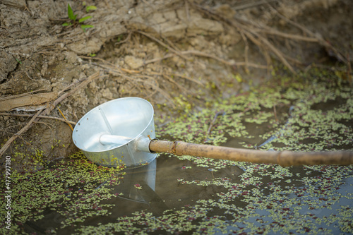 Ground watering cans are used in agricultural gardens in Thailand.