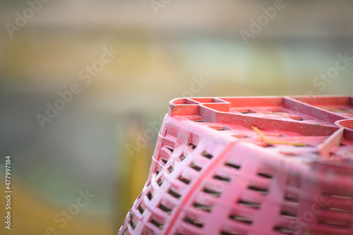 Gardener's red basket with natural background