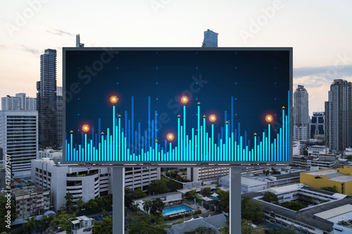 Glowing FOREX graph hologram on billboard  aerial panoramic cityscape of Bangkok at sunset. Stock and bond trading in Southeast Asia. The concept of fund management.