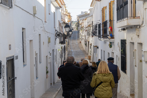 Tourists walking through the old town of Altea (Alicante, Spain) © MiguelAngel