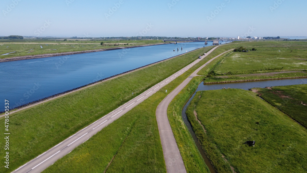 Aerial view on green polders, meadows and water transportion channel in South Beveland, Zeeland, Netherlands