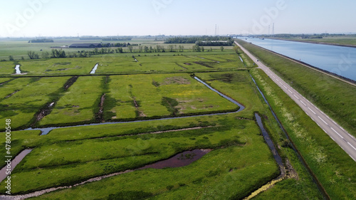 Aerial view on green polders, meadows and water transportion channel in South Beveland, Zeeland, Netherlands photo