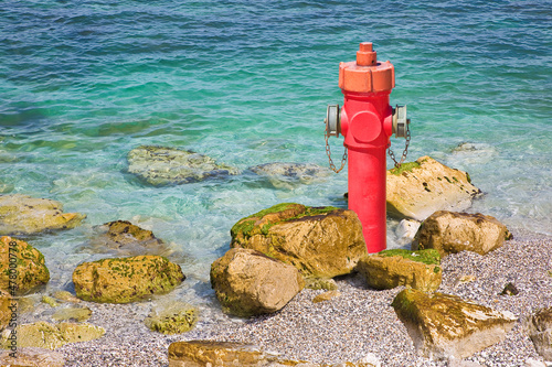 An improbable hydrant at the seaside - Plenty of water concept image