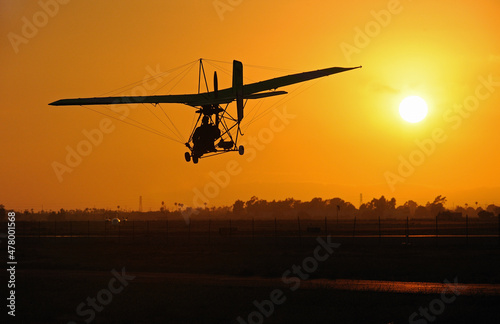 Single seat ultra light coming in for landing at sunset, Camarillo Airport, Camarillo, CA, USA photo
