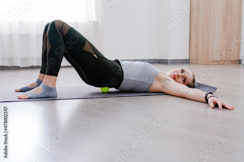 Woman use Myofascial release massage balls on hip selective focus