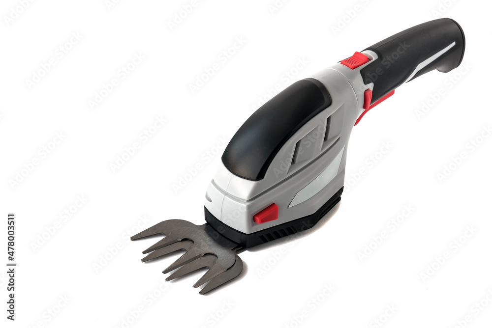 Garden tool for trimming bushes, branches, lawn processing in the garden yard. Brush cutter scissors for household use. Power from the built-in battery. Garden tool for trimming bushes, branches, lawn processing in the garden yard. Brush cutter scissors for household use. Power from the built-in battery.