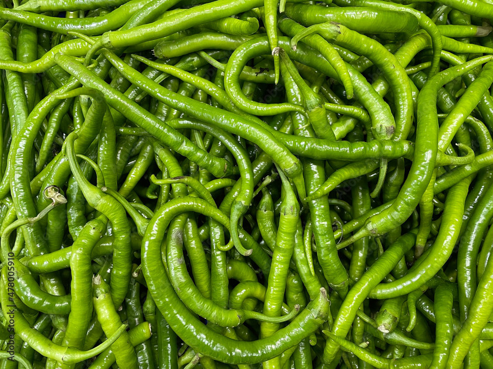 Many of green chili peppers at the local farmers market. Organic food Many of green chili peppers at the local farmers market. Organic food
