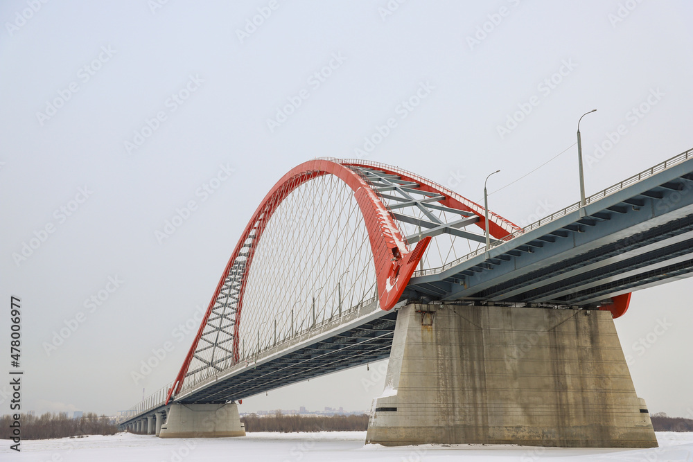 The large red arch bridge in winter close-up