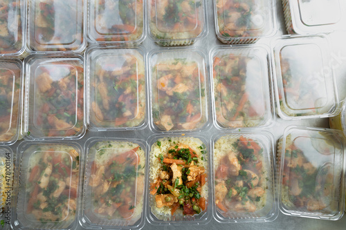 food delivery in the restaurant. Business lunch in an eco-friendly plastic container, ready for delivery. View from above. Office Lunch boxes with rice meals. Food is taken away. Meals,