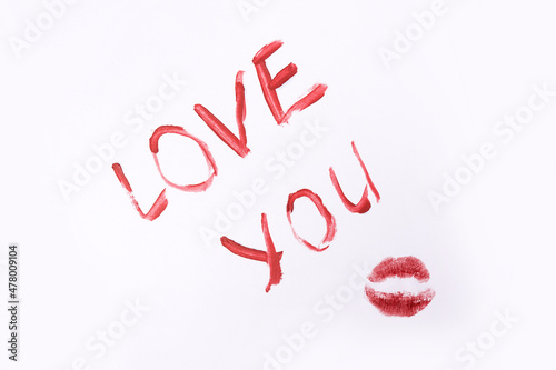 Red color lipstick paint text i love you isolated on white background