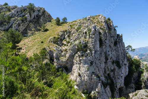 beautiful mediterranean mountain landscape in Spain white rocks and green grass 