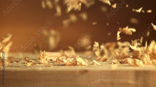 Sawdust falls on the table. Macro background.Filmed is slow motion 1000 fps. High quality FullHD footage photo