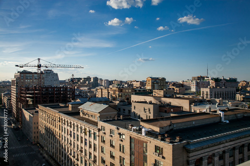 Panorama with construction of new building in Moscow downtown with girder crane. Morning view.