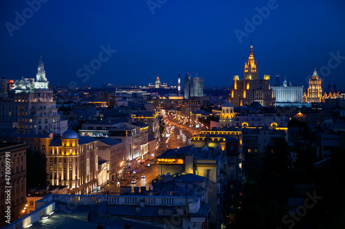 Panorama of evening or night illuminated building of Moscow Garden Ring. Famous Stalinist building. Deep blue sky. photo