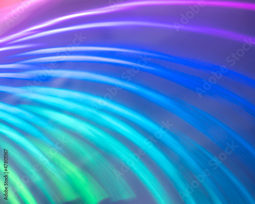 Abstract blue green and purple stripes of light