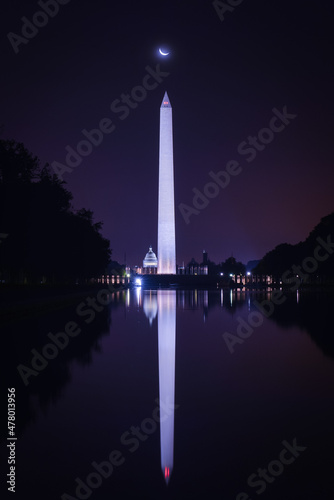 Washington DC Monuments including US Capitol and Washington Monument and ww2 monument with a crescent moon at night - Washington DC United States