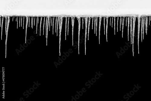 natural icicles isolated on a black background