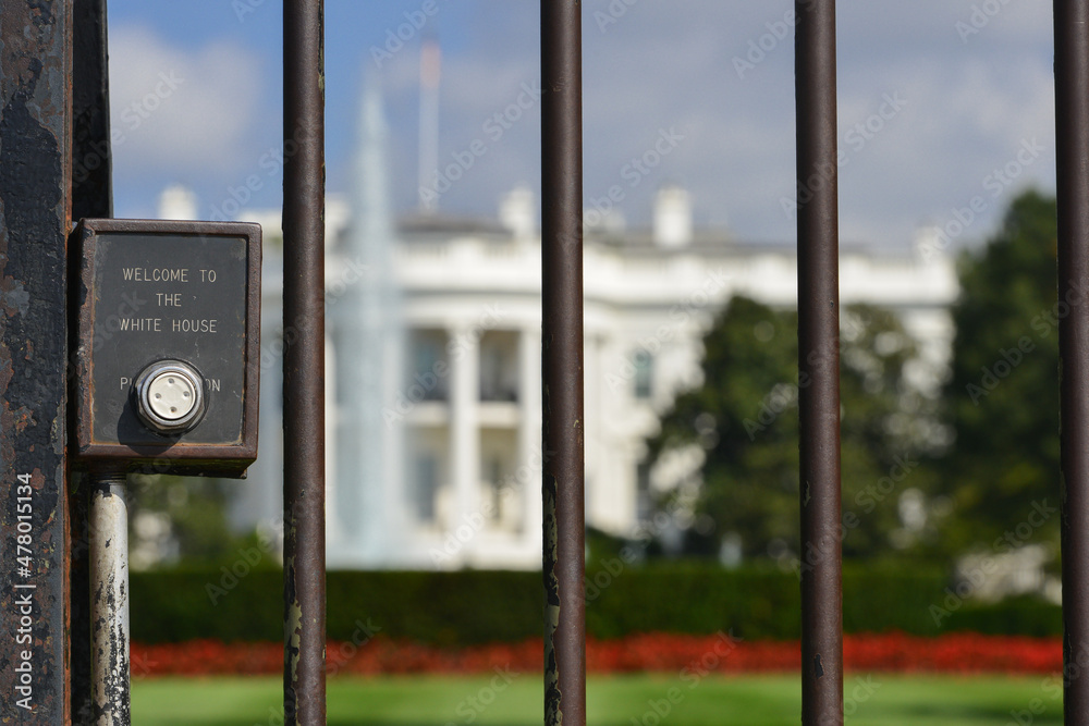Iron fence and welcome sign in front of White House in Washington DC United States Iron fence and welcome sign in front of White House in Washington DC United States