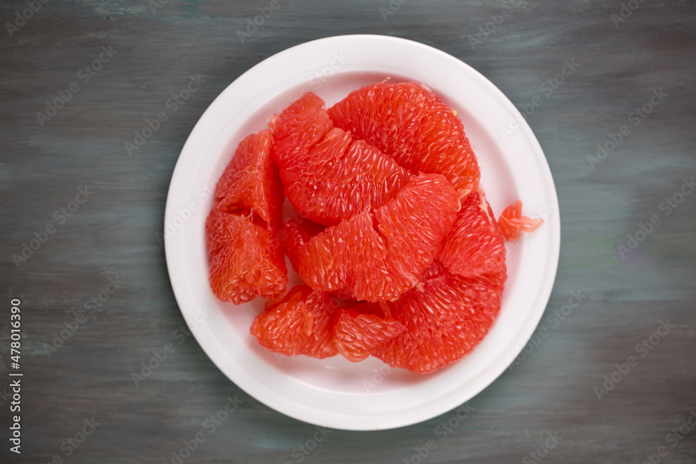 delicious ripe grapefruit on a white plate delicious ripe grapefruit on a white plate