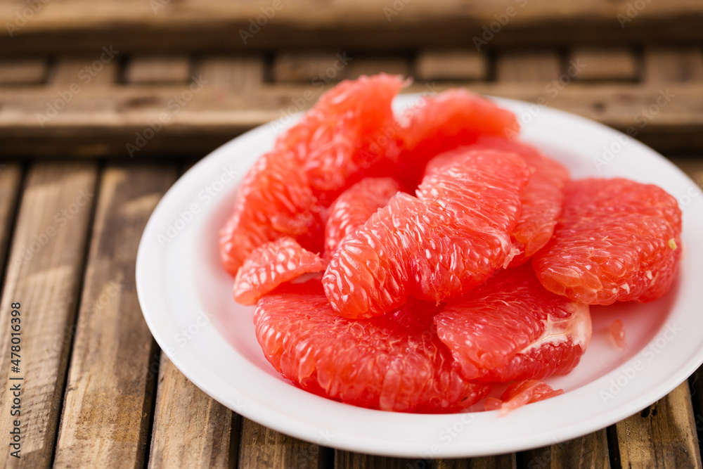 Juicy ripe grapefruit on a rustic background Juicy ripe grapefruit on a rustic background