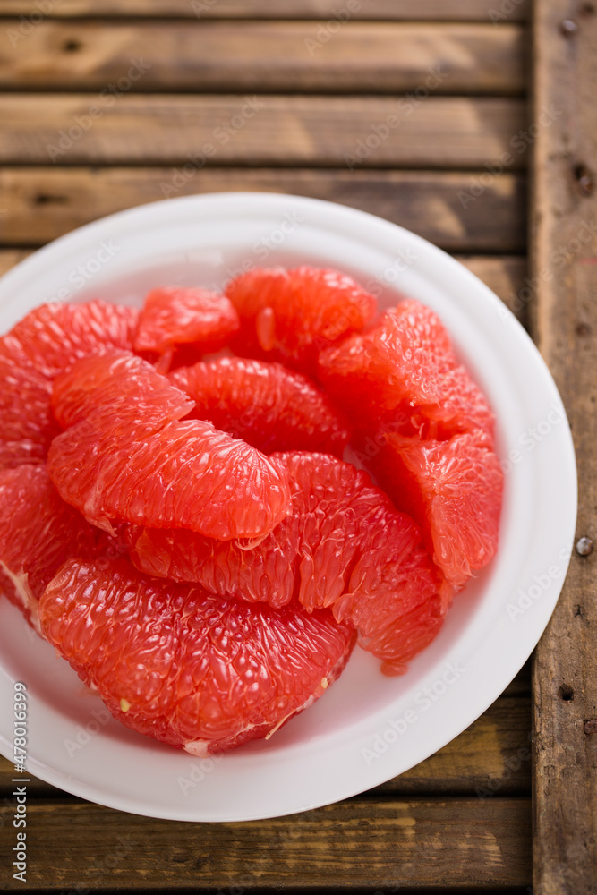 Juicy delicious grapefruit on a rustic background Juicy delicious grapefruit on a rustic background